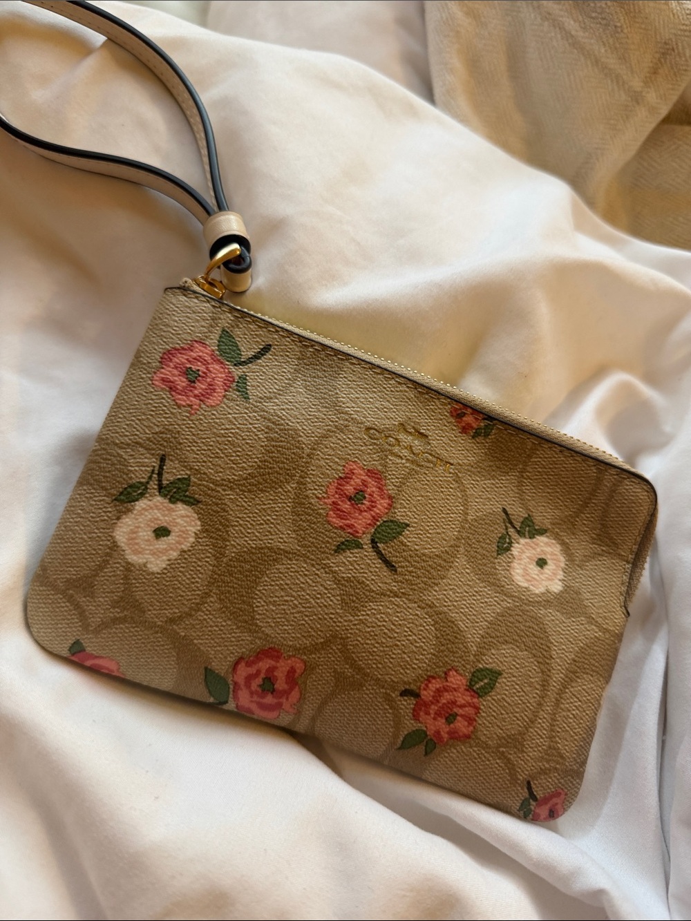 Coach Beige Signature Floral Wristlet with Pink Accents